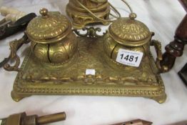 An ornate Victorian French brass inkstand