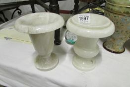 A pair of marble urns