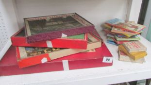 A mixed lot of old games, playing cards and books