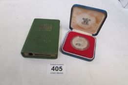 A Post Office savings money box and a 1977 silver crown