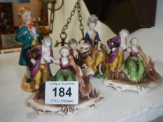 3 Metzel figurines and one other