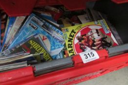 A large box of football programmes