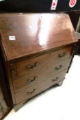 A mahogany inlaid bureau