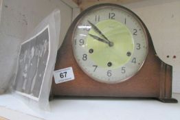 A Smith's mantel clock with presentation photo