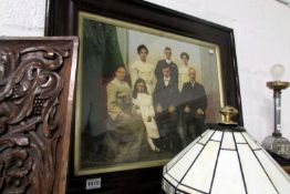 A large framed family portrait photograph