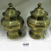 A pair of Early Chinese lidded brass urns