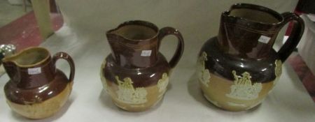 A set of 3 graduated Doulton Lambeth stoneware tavern jugs