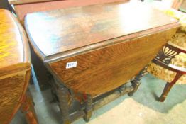 An oak barley twist gate leg table