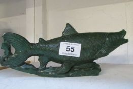 A carved stone fish