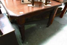 A mahogany dining table