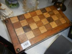 A cased wooden chess set