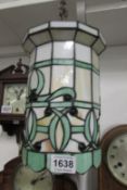 An ornate leaded glass hall lantern