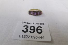 A 9ct gold 5 stone amethyst ring HM London 1971, size M