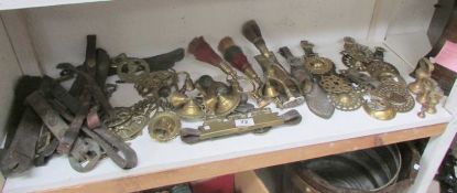 A mixed lot of horse brasses, leathers etc