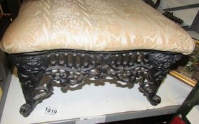 A cast iron footstool