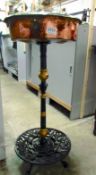 A copper and iron plant stand