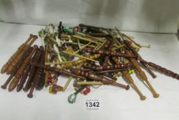 A quantity of lace bobbins and other needlework items