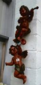 A pair of wall hanging cherubs