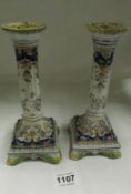 A pair of Quimper candlesticks