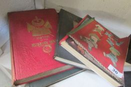 A quantity of old books including 'History of the Russian War' and a rag book