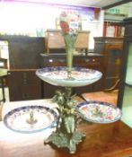 An ornate brass and ceramic table centrepiece