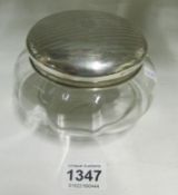 A silver lidded powder bowl