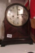 A mahogany inlaid mantel clock