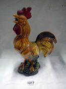 A pottery figure of a cockerel