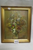 An oil on board, vase of flowers signed D Warrinder