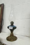 A small oil lamp with blue glass font