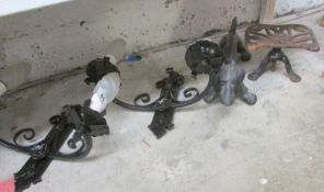 A pair of iron wall lights, dachsund boot scraper and a trivet