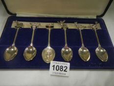 A cased set of silver plated spoons with hunting theme