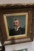 An overpainted photograph portrait of a man in gilt frame,