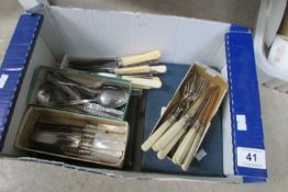 A box of cutlery including silver plate