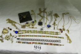 A mixed lot of pendants, bracelets, brooches, earrings etc