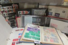 9 albums of stamps and first day covers