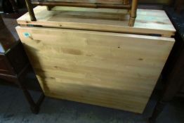 A pine drop leaf table