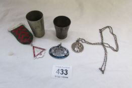 2 whisky measures, A Jack Daniels medallion, Silver St. Christopher and a safety medal