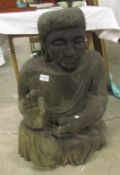 A large carved wood specially commissioned Buddha