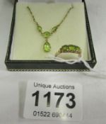 A Peridot necklace and a 9ct gold ring
