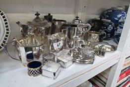 A mixed lot of silver plate including tea set, teapot etc
