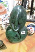 A green stone carved figure