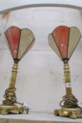A pair of brass table lamps with Tiffany style shades