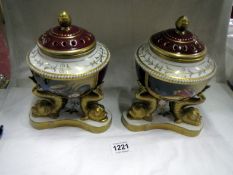 A pair of Continental porcelain pot pourri urns