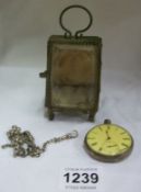 A silver pocket watch, a/f and chain inside a pocket watch display stand/cabinet