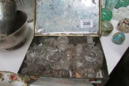 An old tin of Victorian glass door knobs