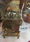 A brass lantern clock