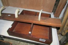 A mahogany cutlery tray and a coat rack