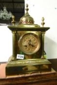 A brass Palladian style mantel clock