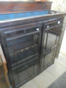 A mahogany glazed bookcase top